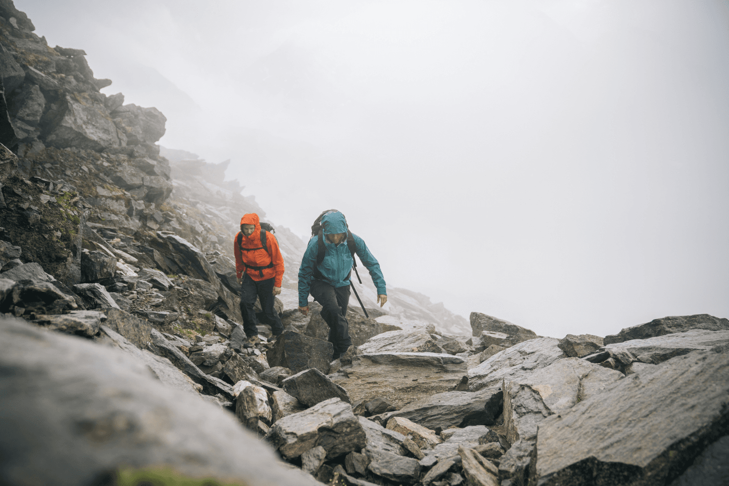 Misty mountain landscape with hikers in the background